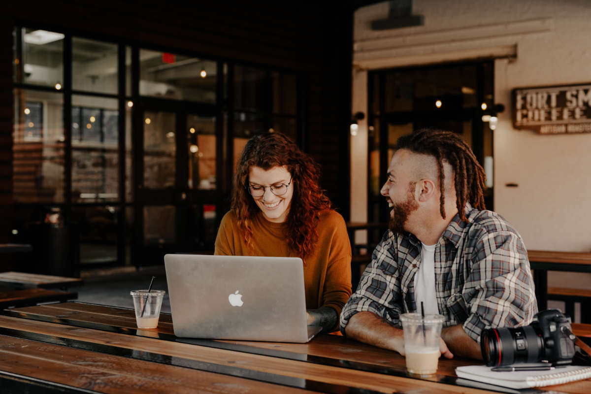 two freelancers working remotely in a coffee shop