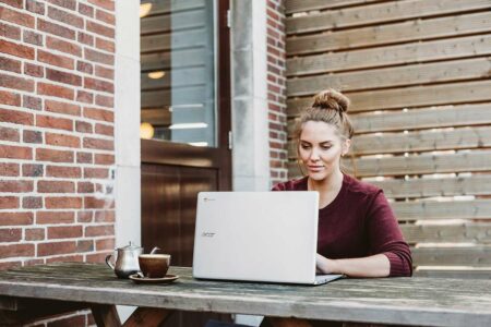 Person working on a laptop, learning digital marketing skills from online resources, representing the journey to becoming a digital marketer with no prior experience