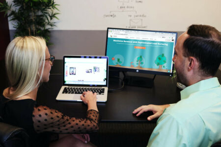 Two digital marketers collaborating at a digital marketing agency