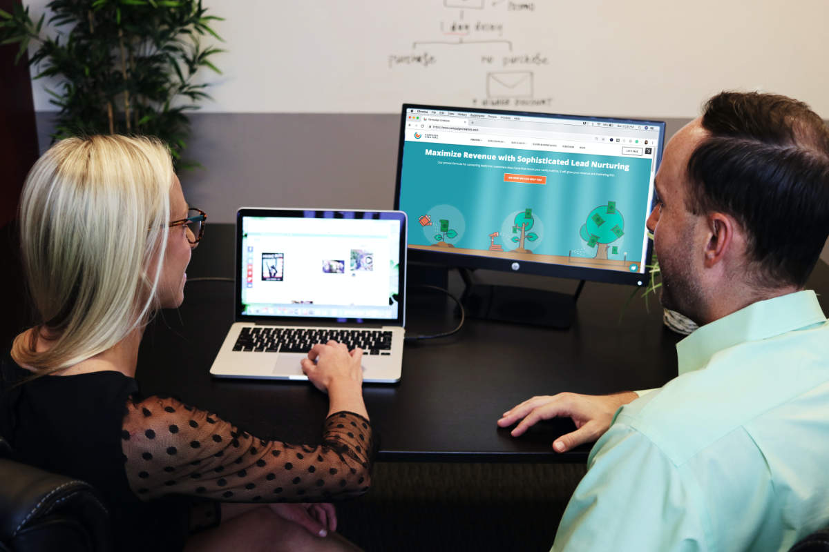 Two digital marketers collaborating at a digital marketing agency